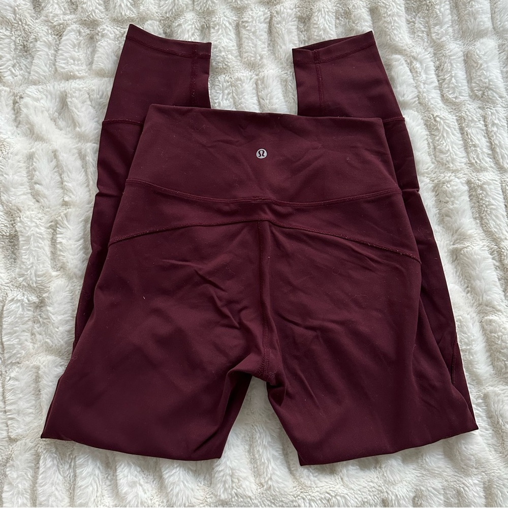 Maroon colored Lululemon leggings